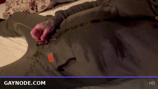 Twink in a Onesie Gets Messy with Pee and Cum Play in Bed